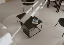 Parcours communautaire, tables basses noires vues en plongée — rendu intérieur