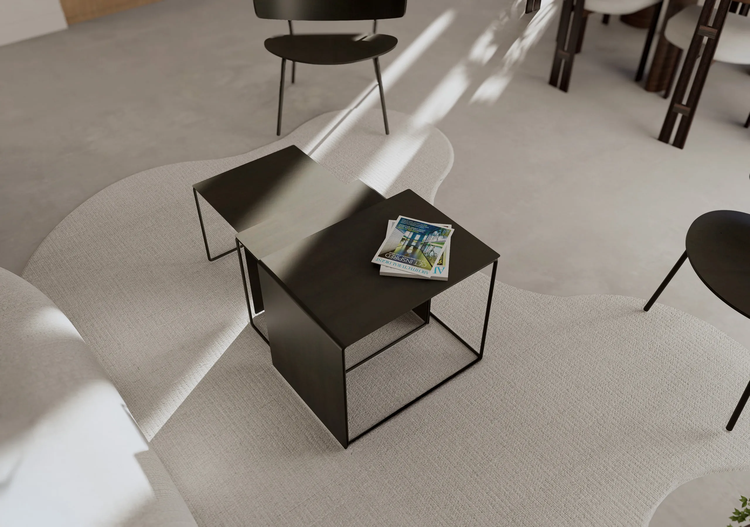 Vue plongeante sur les tables basses noires et le tapis du salon — Paris, France
